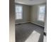 Neutrally painted bedroom with carpet, natural light from two windows, and a modern feel at 1237 E 29Th St, Anderson, IN 46016