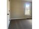 Neutral-toned bedroom with cozy carpet, a bright window, and neutral paint at 1237 E 29Th St, Anderson, IN 46016