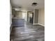 Stylish kitchen featuring stainless steel appliances, breakfast bar, and vinyl flooring at 1237 E 29Th St, Anderson, IN 46016