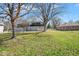 Expansive backyard with mature trees and lawn at 1310 Bowman Dr, Greenfield, IN 46140