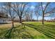 This is a view of the expansive backyard lawn and trees at 1310 Bowman Dr, Greenfield, IN 46140