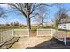 Wooden deck with white railing and a view of the backyard and neighboring homes at 1310 Bowman Dr, Greenfield, IN 46140