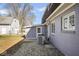 Charming backyard exterior, showcasing a shed, AC unit, and view of the house at 1310 Bowman Dr, Greenfield, IN 46140