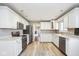 Spacious kitchen with white cabinets and stainless steel appliances, offering ample countertop space at 1310 Bowman Dr, Greenfield, IN 46140