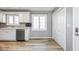 Kitchen featuring white cabinets, stainless steel appliances, and double door pantry at 1310 Bowman Dr, Greenfield, IN 46140