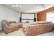 Comfortable living room featuring a large screen projector, wood paneling, and neutral carpet at 1310 Bowman Dr, Greenfield, IN 46140