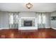 Bright living room features hardwood floors and a fireplace with built-in shelves at 1310 Bowman Dr, Greenfield, IN 46140
