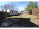 Fenced backyard featuring a small wood deck, offering privacy and space for outdoor seating and entertainment at 1334 Hannibal St, Noblesville, IN 46060