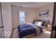 A tastefully decorated bedroom boasts ample light and modern design at 1334 Hannibal St, Noblesville, IN 46060