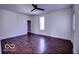 Bright bedroom showcasing wood floors, a window for natural light, and ample space for furniture and decor at 1334 Hannibal St, Noblesville, IN 46060
