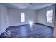 Bright bedroom with attractive flooring features two large windows offering ample natural light at 1334 Hannibal St, Noblesville, IN 46060