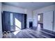 Bright bedroom with fireplace and wardrobe offers lots of natural light and a glimpse into the next room at 1334 Hannibal St, Noblesville, IN 46060