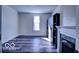 An empty bedroom with a fireplace, offering ample natural light and space for customization at 1334 Hannibal St, Noblesville, IN 46060
