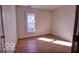 A clean, bright bedroom with hardwood floors and ample natural light from large windows at 1334 Hannibal St, Noblesville, IN 46060