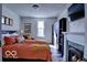 Cozy bedroom features a fireplace, ample natural light, and an attractive, modern wardrobe at 1334 Hannibal St, Noblesville, IN 46060