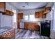 A charming kitchen with wooden cabinets, modern appliances, and a bright double window at 1334 Hannibal St, Noblesville, IN 46060