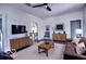 The spacious living room with hardwood floors, ceiling fan and plenty of natural light is perfect for relaxing or entertaining at 1334 Hannibal St, Noblesville, IN 46060