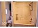 Standard shower and tub combo with white interior and chrome fixtures at 1334 Hannibal St, Noblesville, IN 46060