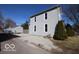Exterior shot of the side of the house with a gravel driveway and a detached garage for ample parking or storage at 1334 Hannibal St, Noblesville, IN 46060