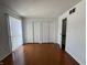 A bedroom with beautiful hardwood floors and closet spaces at 1344 Tishman Ln # 1344, Indianapolis, IN 46260