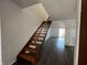 Inviting living room featuring hardwood floors and staircase to the second floor at 1344 Tishman Ln # 1344, Indianapolis, IN 46260