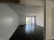 Living room with sliding glass doors, white brick accent wall, and hardwood floors at 1344 Tishman Ln # 1344, Indianapolis, IN 46260