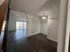 Open floor plan showcasing hardwood floors, white walls, and natural light at 1344 Tishman Ln # 1344, Indianapolis, IN 46260