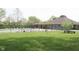 Community pool area with a fenced perimeter and ample seating for residents at 1344 Tishman Ln # 1344, Indianapolis, IN 46260