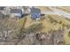 Beautiful aerial view of the home featuring a spacious backyard with a firepit area and patio at 13615 Moorcroft Dr, Fishers, IN 46037