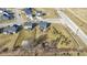 This aerial view displays the backyard, patio, firepit, and proximity to community features like a basketball court at 13615 Moorcroft Dr, Fishers, IN 46037