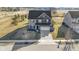 Aerial view of a two-story home with well-maintained landscaping and a long driveway at 13615 Moorcroft Dr, Fishers, IN 46037