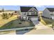 Gorgeous home featuring a two-car garage and well-manicured lawn on a sunny day at 13615 Moorcroft Dr, Fishers, IN 46037
