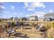 Relaxing backyard featuring an outdoor firepit with seating, perfect for entertaining guests in comfort and style at 13615 Moorcroft Dr, Fishers, IN 46037