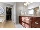 Bright bathroom featuring a double vanity, soaking tub, walk-in closet, and neutral tones at 13615 Moorcroft Dr, Fishers, IN 46037