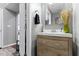 Well-lit bathroom featuring wood vanity with stylish decor and modern sink at 13615 Moorcroft Dr, Fishers, IN 46037
