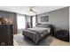 Cozy bedroom with a ceiling fan, a decorative sign, and plush, modern furnishings at 13615 Moorcroft Dr, Fishers, IN 46037