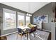 Bright dining room with vaulted ceiling and large windows at 13615 Moorcroft Dr, Fishers, IN 46037