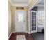 The foyer offers a glimpse into the house and the adjacent office/gym area at 13615 Moorcroft Dr, Fishers, IN 46037
