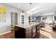Kitchen island featuring granite countertops, bar stools and stainless steel appliances at 13615 Moorcroft Dr, Fishers, IN 46037