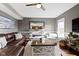 Bright living room featuring a modern fireplace, comfortable seating, and stylish decor at 13615 Moorcroft Dr, Fishers, IN 46037