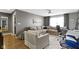 Spacious living room featuring a sectional sofa and home office space at 13615 Moorcroft Dr, Fishers, IN 46037