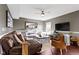 Cozy living room with a plush couch, accent chair, and media center with modern decor at 13615 Moorcroft Dr, Fishers, IN 46037