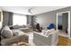 Comfortable living room featuring a sectional sofa and home office space at 13615 Moorcroft Dr, Fishers, IN 46037