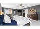 Comfortable main bedroom featuring a large bed and dresser at 13615 Moorcroft Dr, Fishers, IN 46037