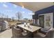 Outdoor patio with dining table, seating, mounted TV, and shade structure at 13615 Moorcroft Dr, Fishers, IN 46037