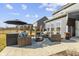 Exterior of house showing the back patio with comfortable outdoor seating at 13615 Moorcroft Dr, Fishers, IN 46037
