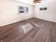 Bright bedroom with natural light, modern ceiling fan, and beautiful flooring at 1378 South St, Noblesville, IN 46060