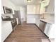 Updated kitchen featuring stainless steel appliances and modern white cabinetry at 1378 South St, Noblesville, IN 46060
