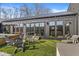Modern home exterior featuring a well-manicured backyard with lounge chairs and a hot tub at 1510 Columbia Ave, Indianapolis, IN 46202