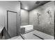 Modern bathroom with a rainfall shower, separate tub, and sleek gray tile at 1510 Columbia Ave, Indianapolis, IN 46202